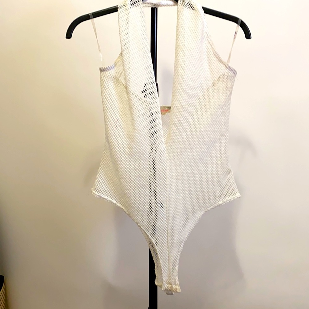 Whit small fishnet body suit